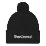 “Black DueCourse beanie with a pom on top, featuring embroidered !DueCourse(TM) logo”